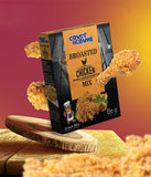 Box of Crust & Crumb Broasted Chicken Mix with fried chicken pieces on a wooden board against a gradient background.