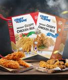 Two boxes of Crust & Crumb Instant Crispy Chicken Mix hot & spicy and ginger garlic with fried chicken on a wooden surface.